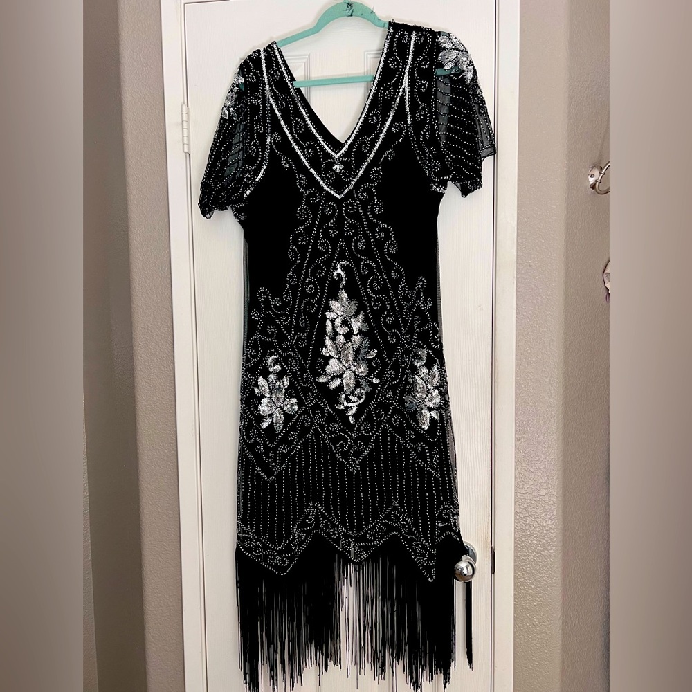 Worm once in great condition, 1920’s era dress. 3x but fits more like a 2x